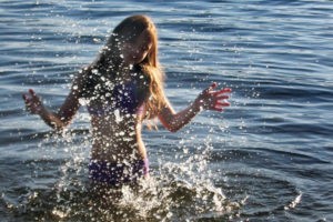 Swimming by the rock on Big Averill Lake, Vermont